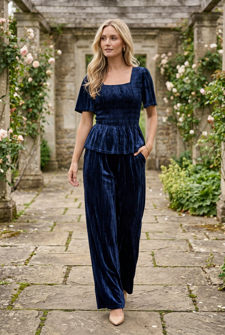 Navy velvet set in a historic garden